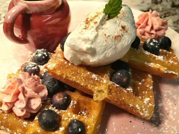 Housemade french toast with berries and whipped cream. 
