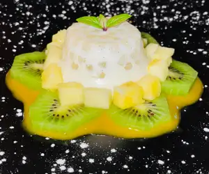 A housemade dessert with kiwi and mango sauce. 
