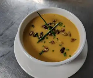 Butternut squash soup with pumpkin seeds. 